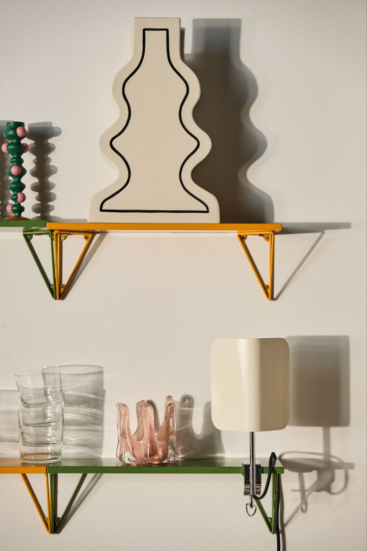 Autumn 2023 interior design trends are playful, decorate with colourful shelves from Maze and decorate with quirky details like this geometric vase from ferm living.