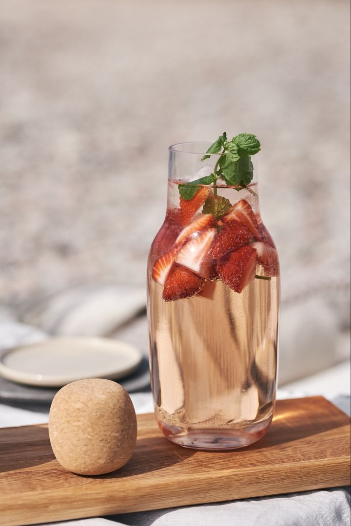 Summer drinks - a refreshing take on sangria - strawberries topped with mint and served in a carafe. 