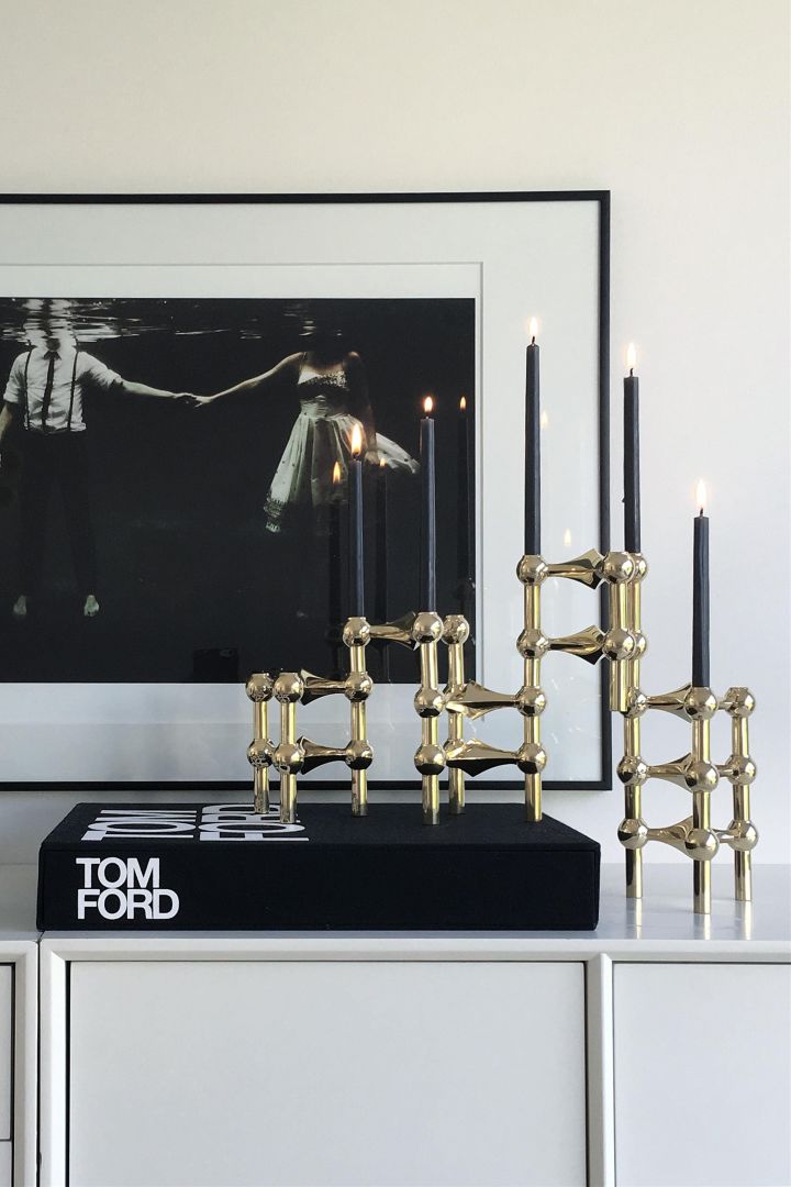 Here you see a collection of the Nagel candle holders from STOFF stacked on a side table - the perfect anniversary gift idea for a couple celebrating their Golden wedding anniversary. 