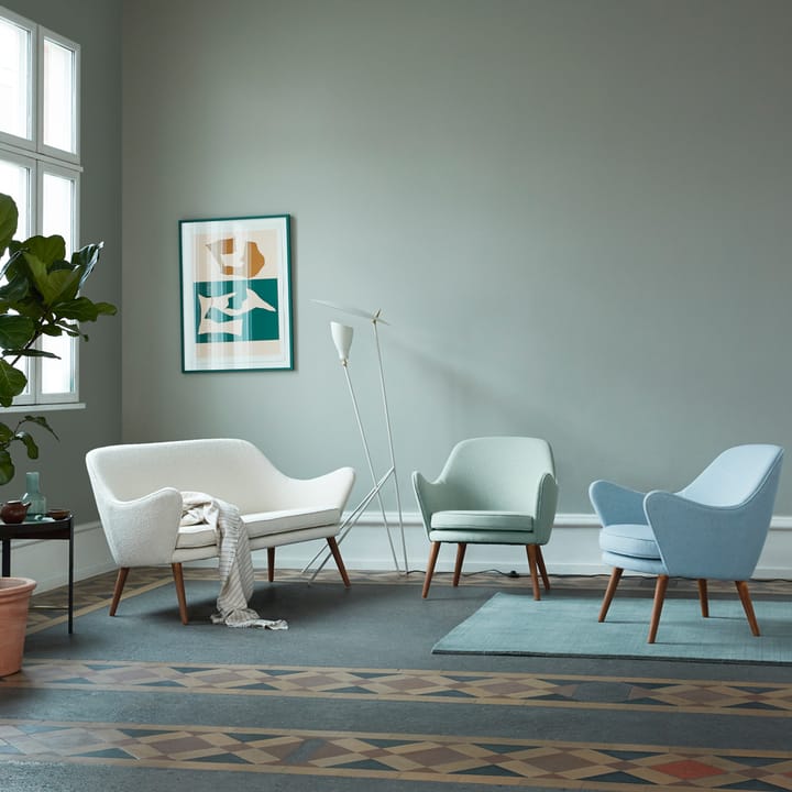 Dwell lounge chair, Fabric merit 021 light cyan, legs in smoked oak Warm Nordic