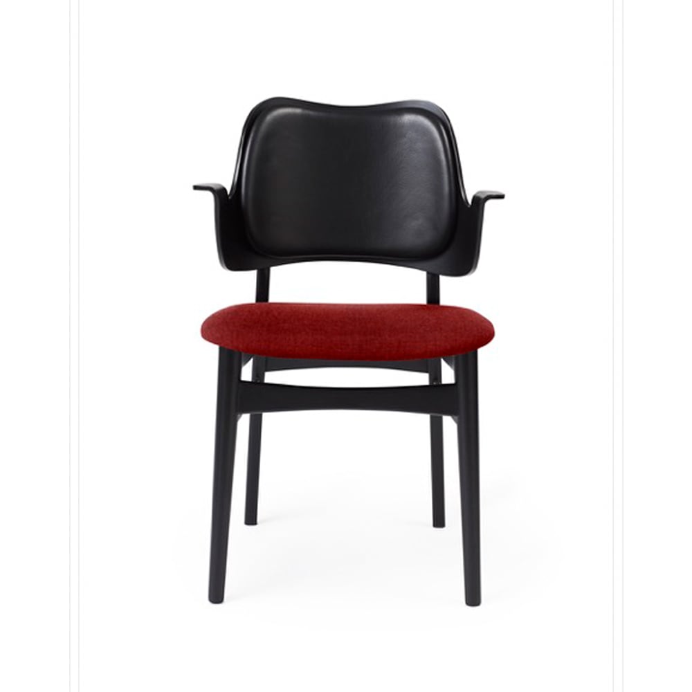 Warm Nordic Gesture chair, upholstered seat and back Fabric brick red, leather backrest, black lacquered beech legs