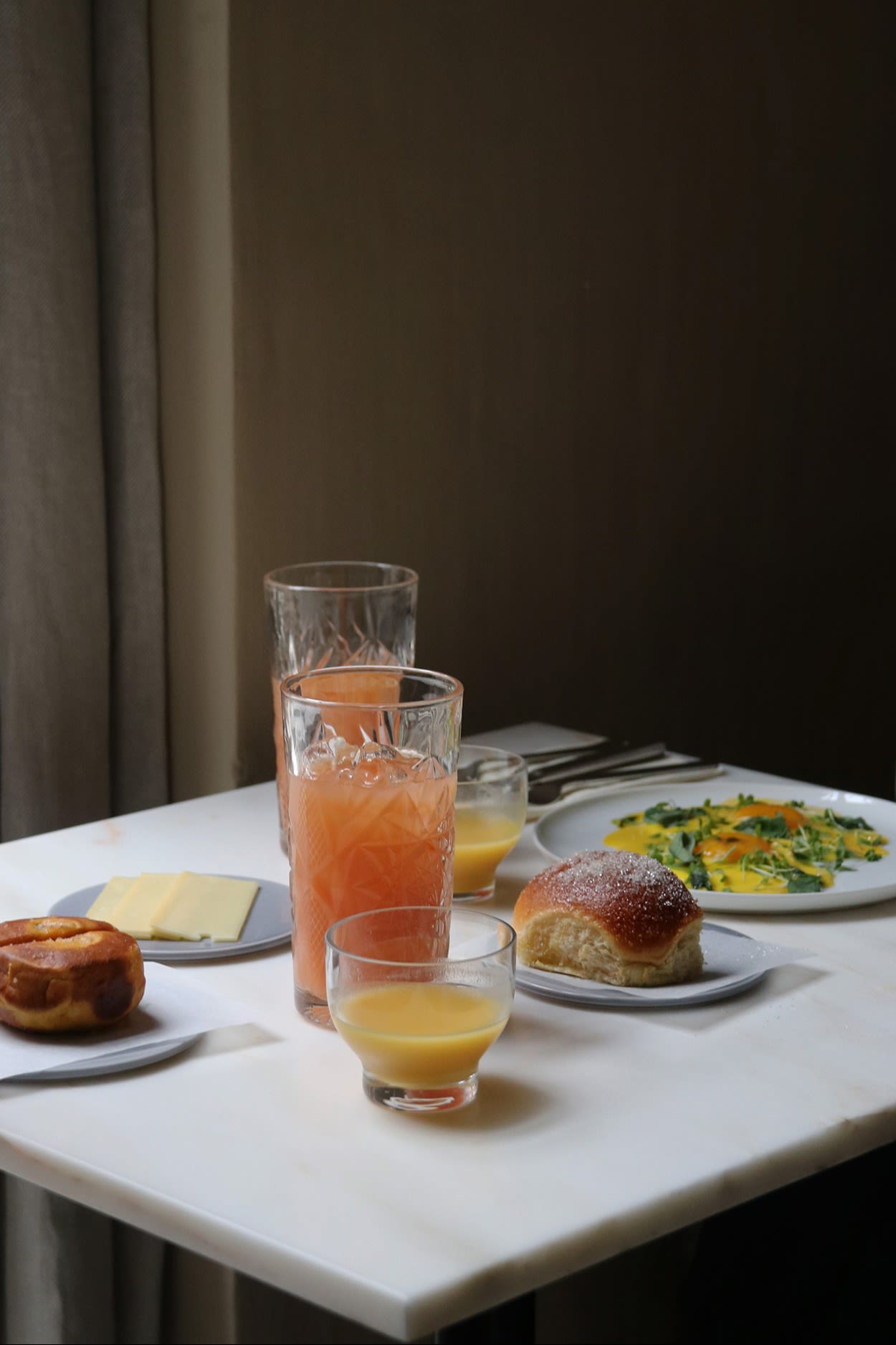 A table set with food and drinks at the Audo Restaurant in Copenhagen. It is the ideal place for a bite to eat at lunchtime for any design lover on a tour of Copenhagen. 