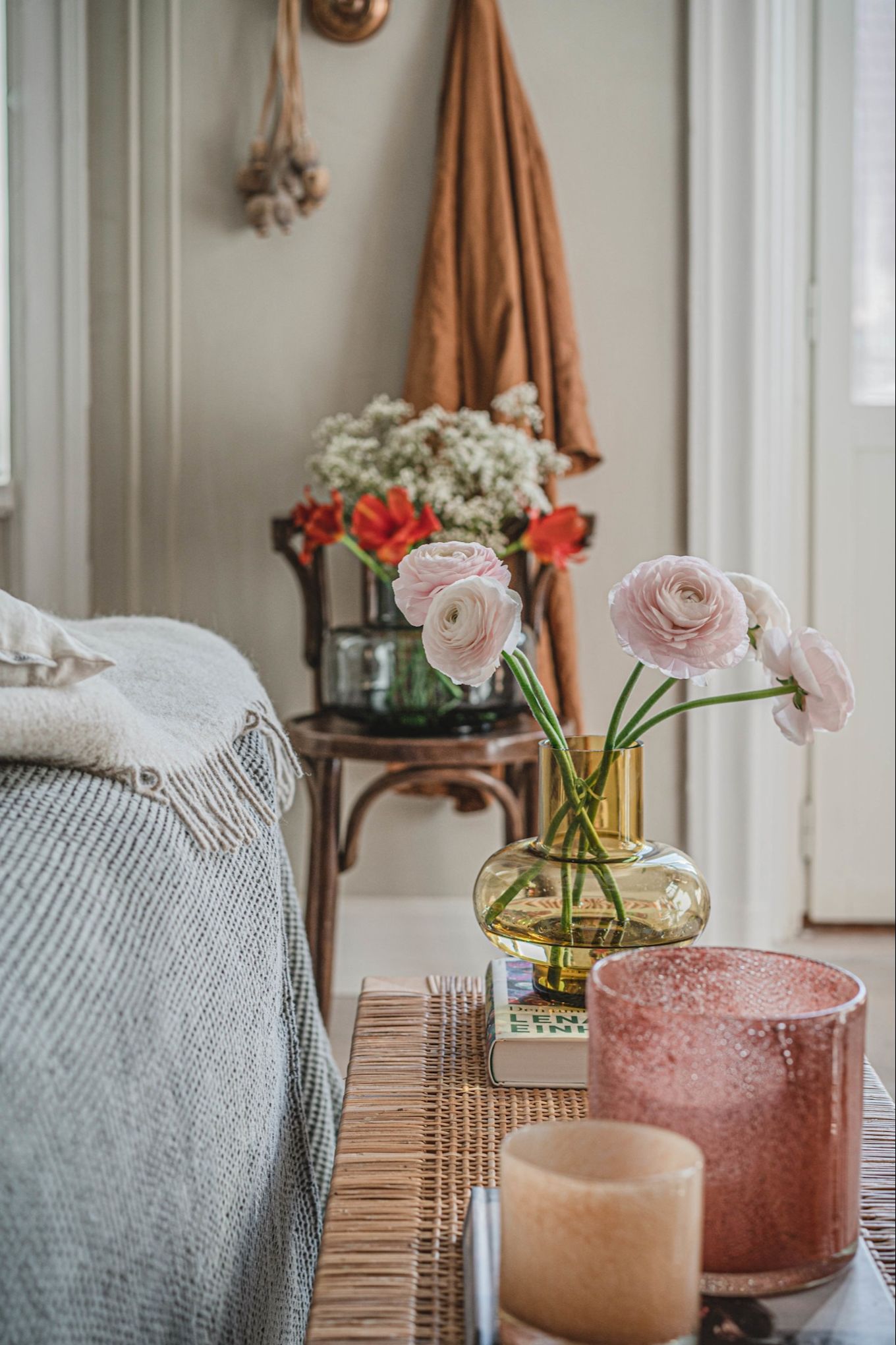 Create a cosy bedroom with flowers and candles to add colour and a cosy light. 