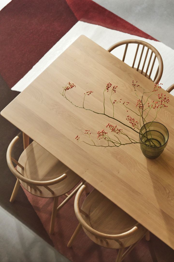 A solid oak dining table and chairs from NJRD.