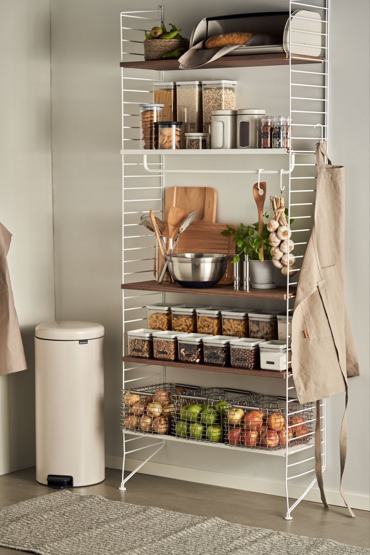 A perfectly organised pantry with a String shelf and the Brabantia storage jars. 