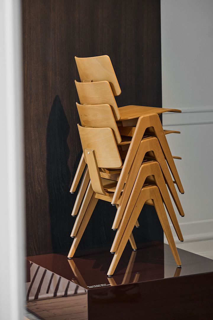 The Daystack wooden chair from &Tradition, here stacked on a podium, was first designed in 1951 by Robin Day, the retro vibes are perfectly in line with the Scandinavian interior design trends for 2025. 