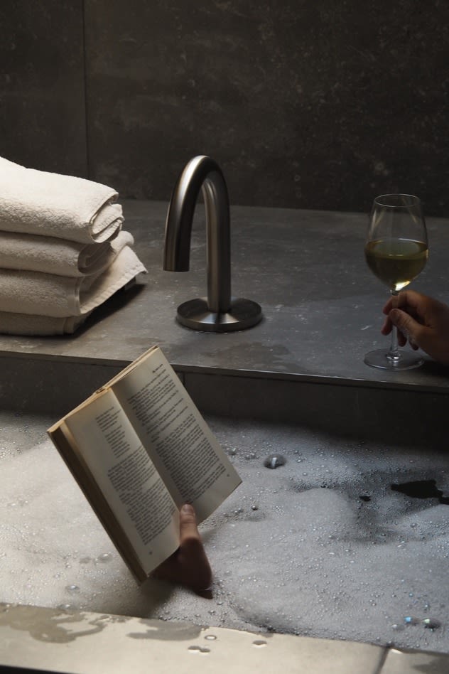 Relaxing in the bathtub at Audo House with a glass of wine and a book is a must for any lover of design. 