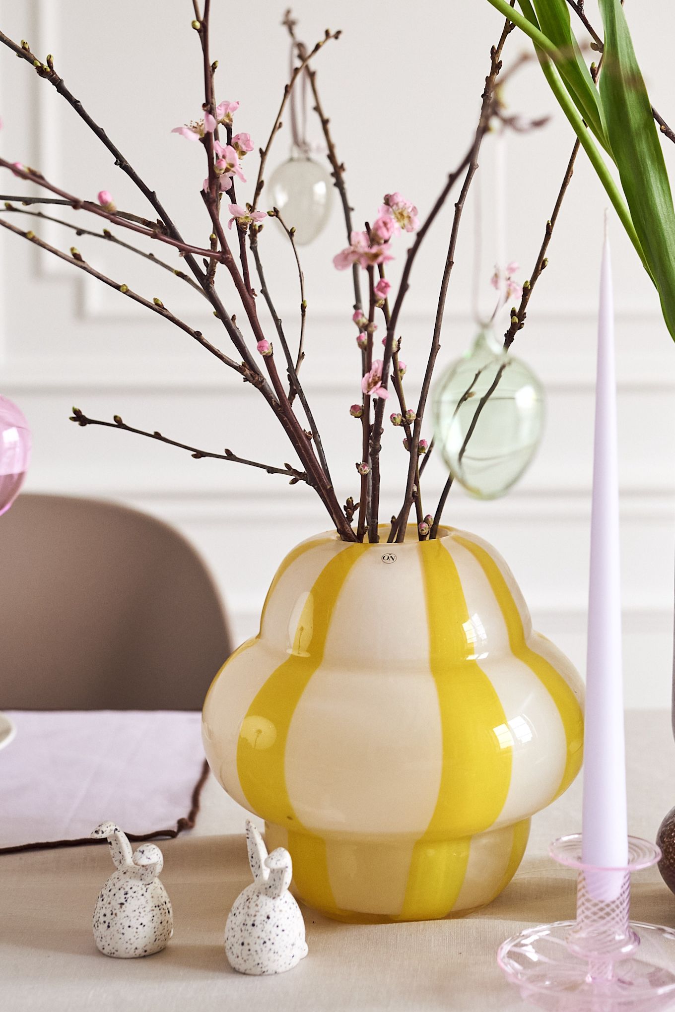 Create an Easter tree at home with colourful vases such as the Curlie vase in yellow from By On or the Dorit vase from Broste Copenhagen.