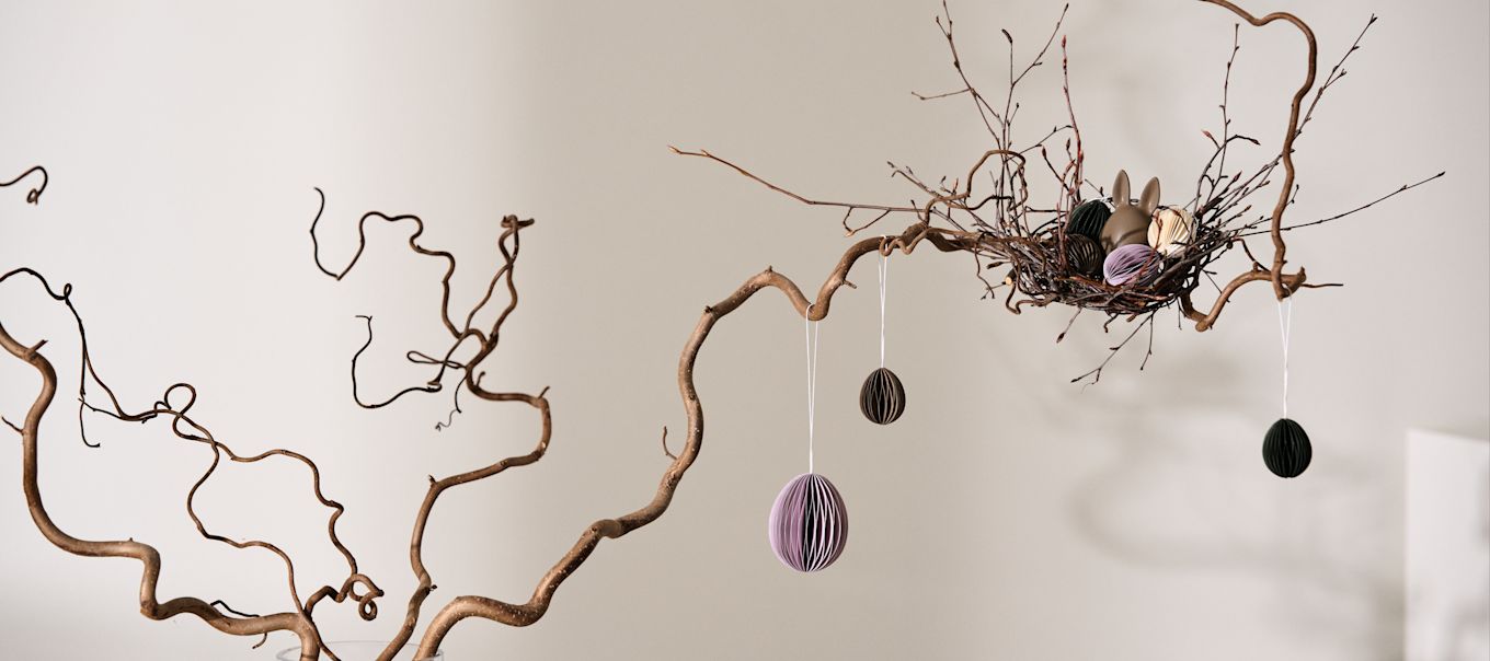 How to make an Easter tree - here you see the DBKD paper egg decorations hanging in the branches of a home made Easter tree. 