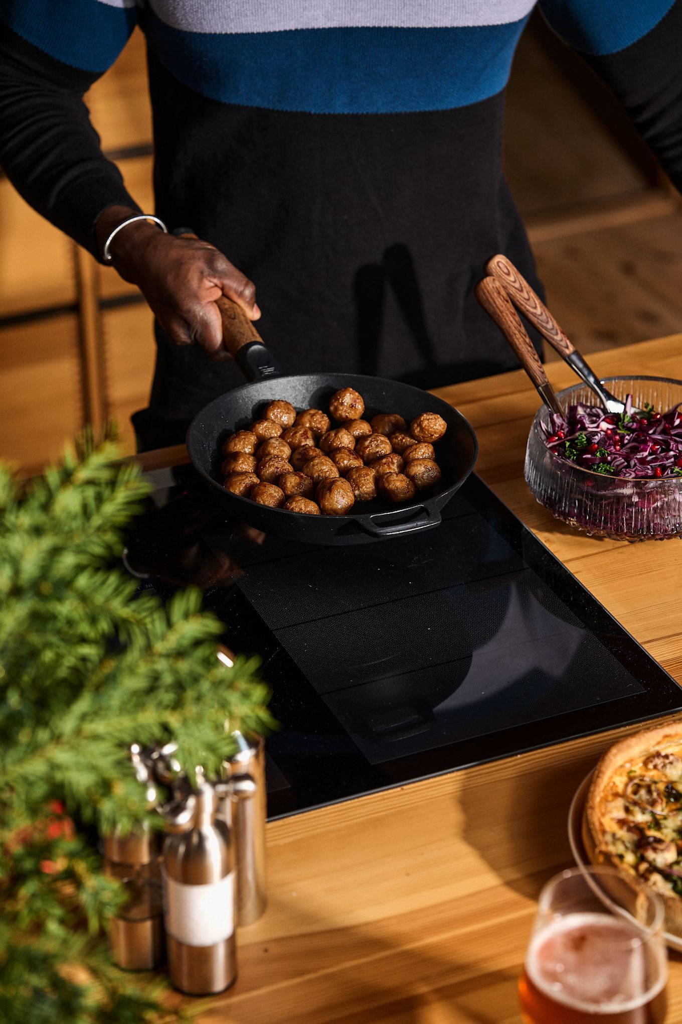 Cooking something typically Scandinavian should definitely be on your winter bucket list. Here you can see a man frying Köttbullar in the Norden pan from Fiskars.