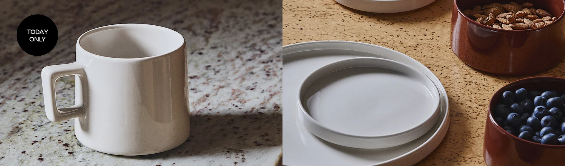 A white ceramic mug with a 'TODAY ONLY' sticker, next to stacked white plates and bowls of almonds and blueberries.