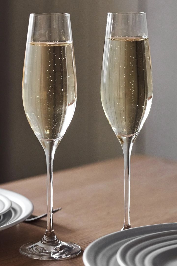 The bride toasts with Cabernet champagne glasses from Holmegaard - an elegant wedding gift idea.