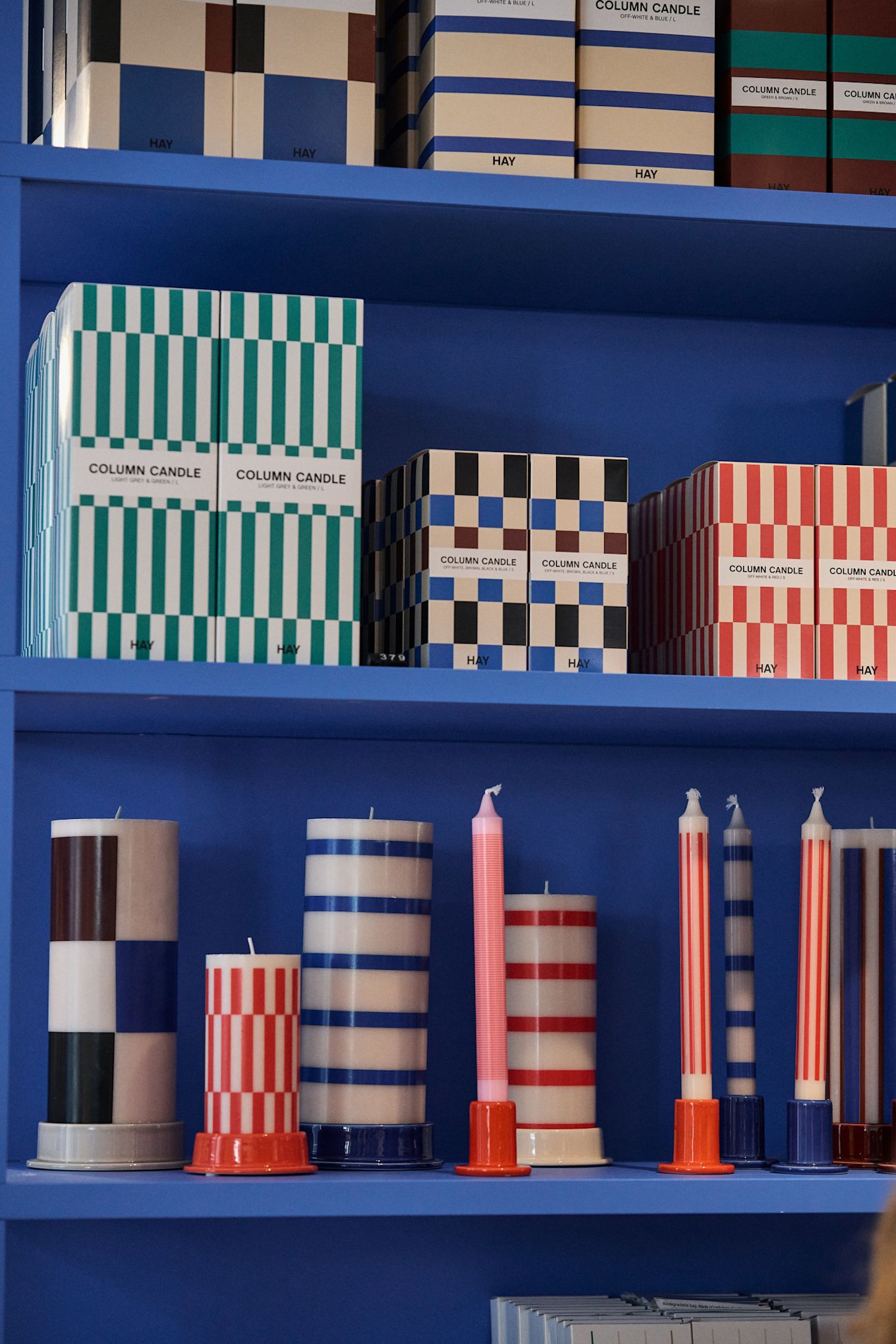 Checks and stripes are set to be a big trend this autumn, here you see a collection of the HAY column candles for sale in their shop. 