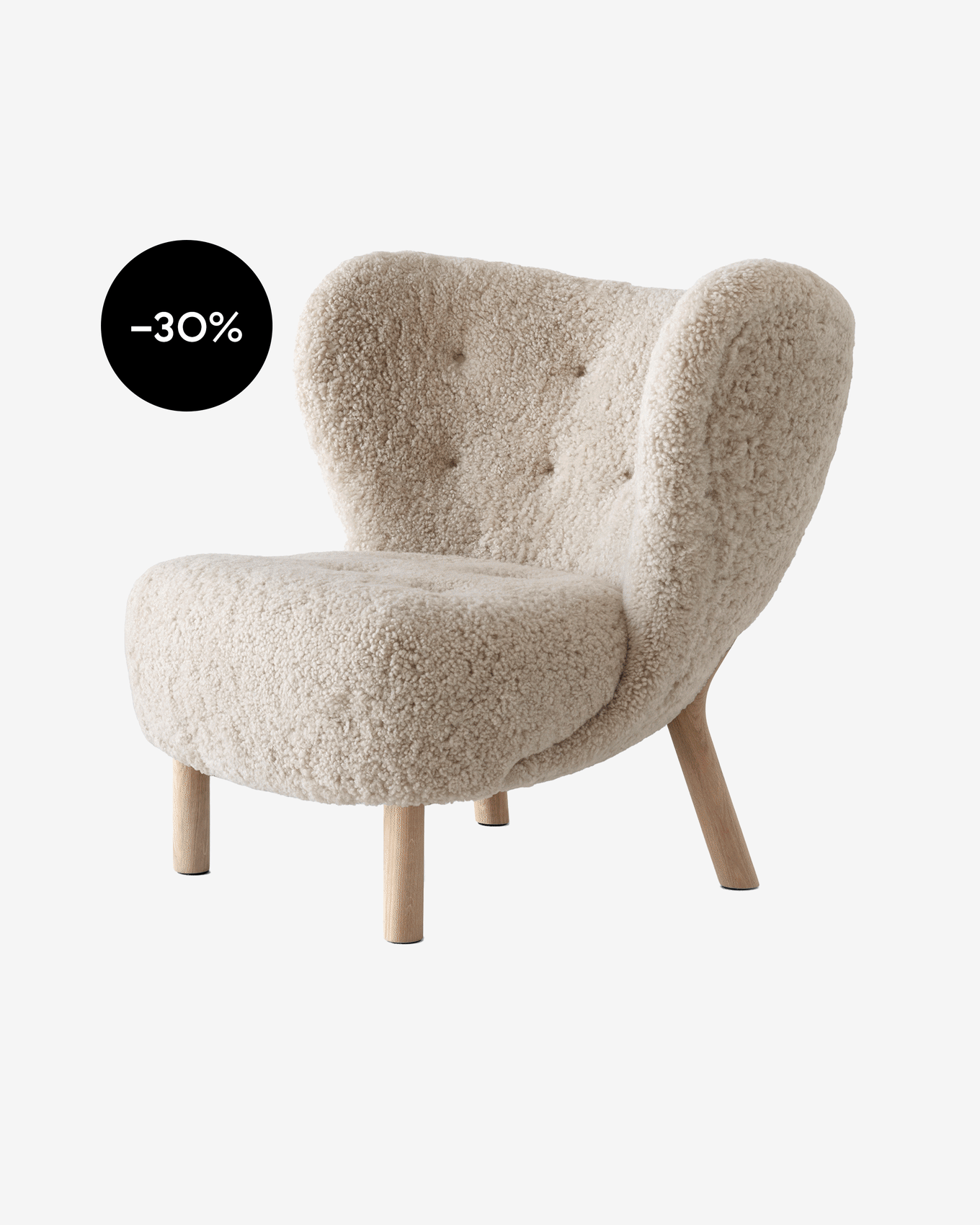Light beige sheepskin armchair with button-tufted back and wooden legs, showing a black -30% sale tag.