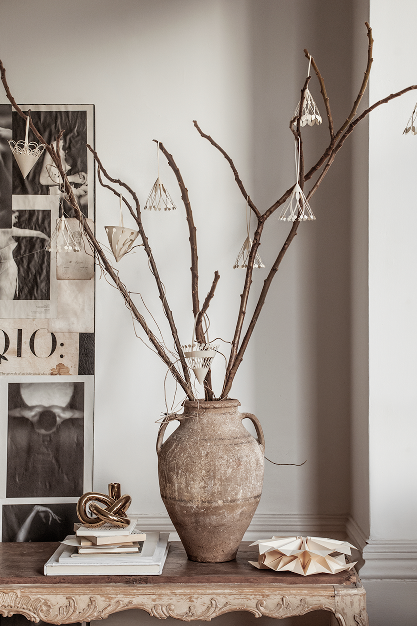 The hanging tree decorations from Ferm Living are not just for Christmas, seen here hanging on some twigs, claimed from the forest. 