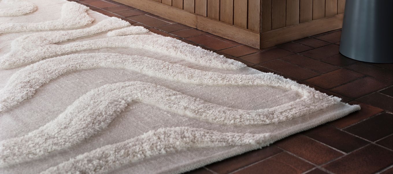 One of Tinted Objects wool rugs in white.