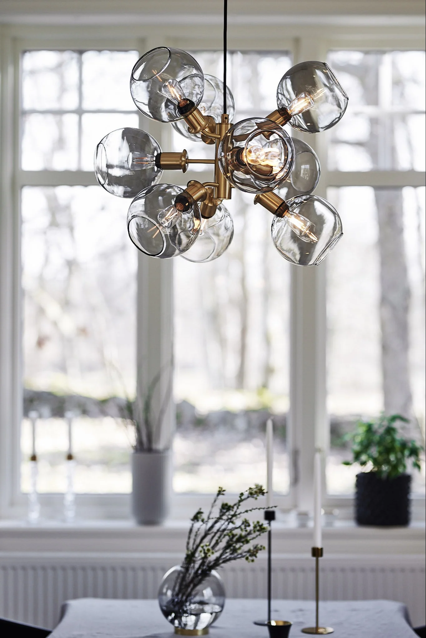 Tage pendant from Care of Bankeryd,Globe vase from AYTM, Cooee candle holder from Cooee Design, Cloudy pot from DBKD.