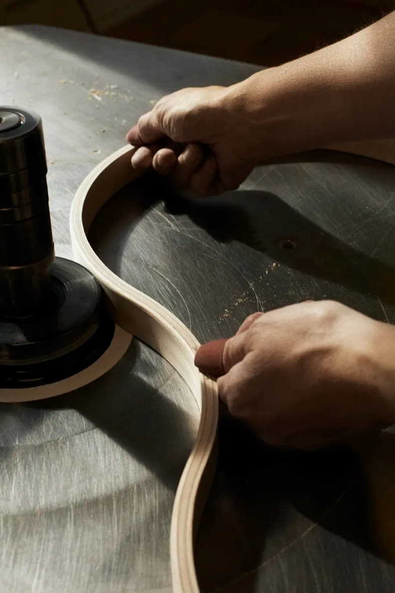 Part of the assembly line for the Lamino armchair, handmade furniture from Sweden.