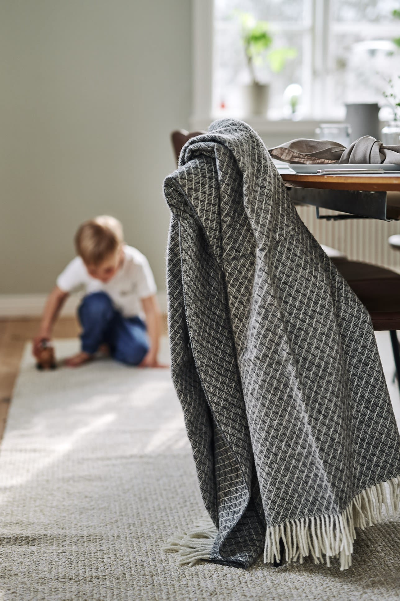 Wicker wool throw from Scandi Living, ,Fallow rug from Scandi Living.