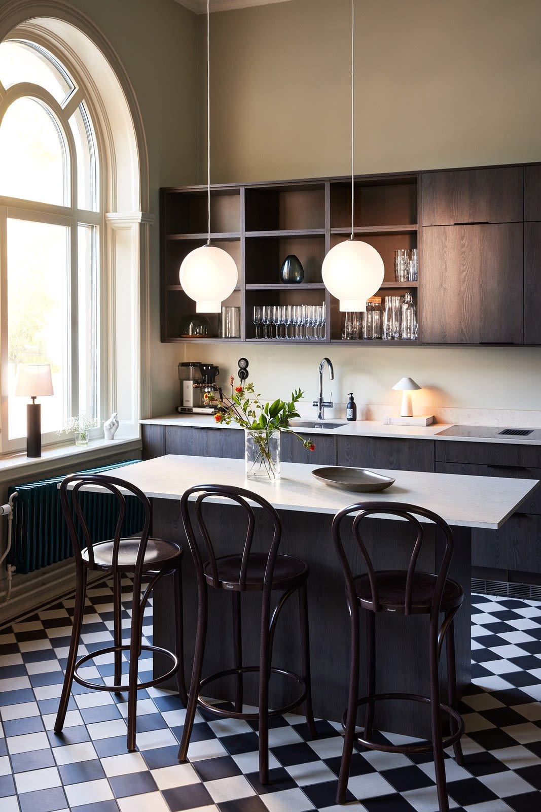 Several pendant lights are recommended to provide sufficient light. Here you can see two Bams pendant lights from Globen Lighting hanging above a kitchen island.