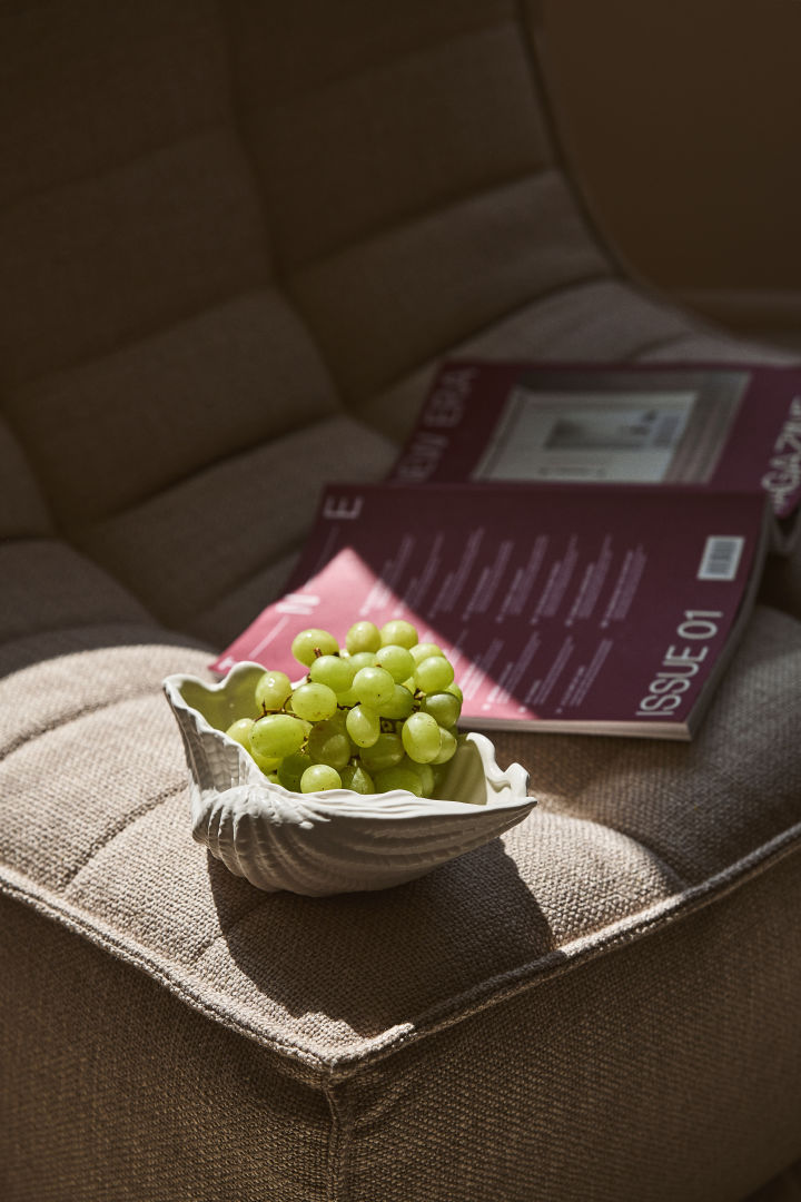 Shell is one of Byon's bestsellers and is a series of shell-shaped objects, here a bowl with green grapes in it.