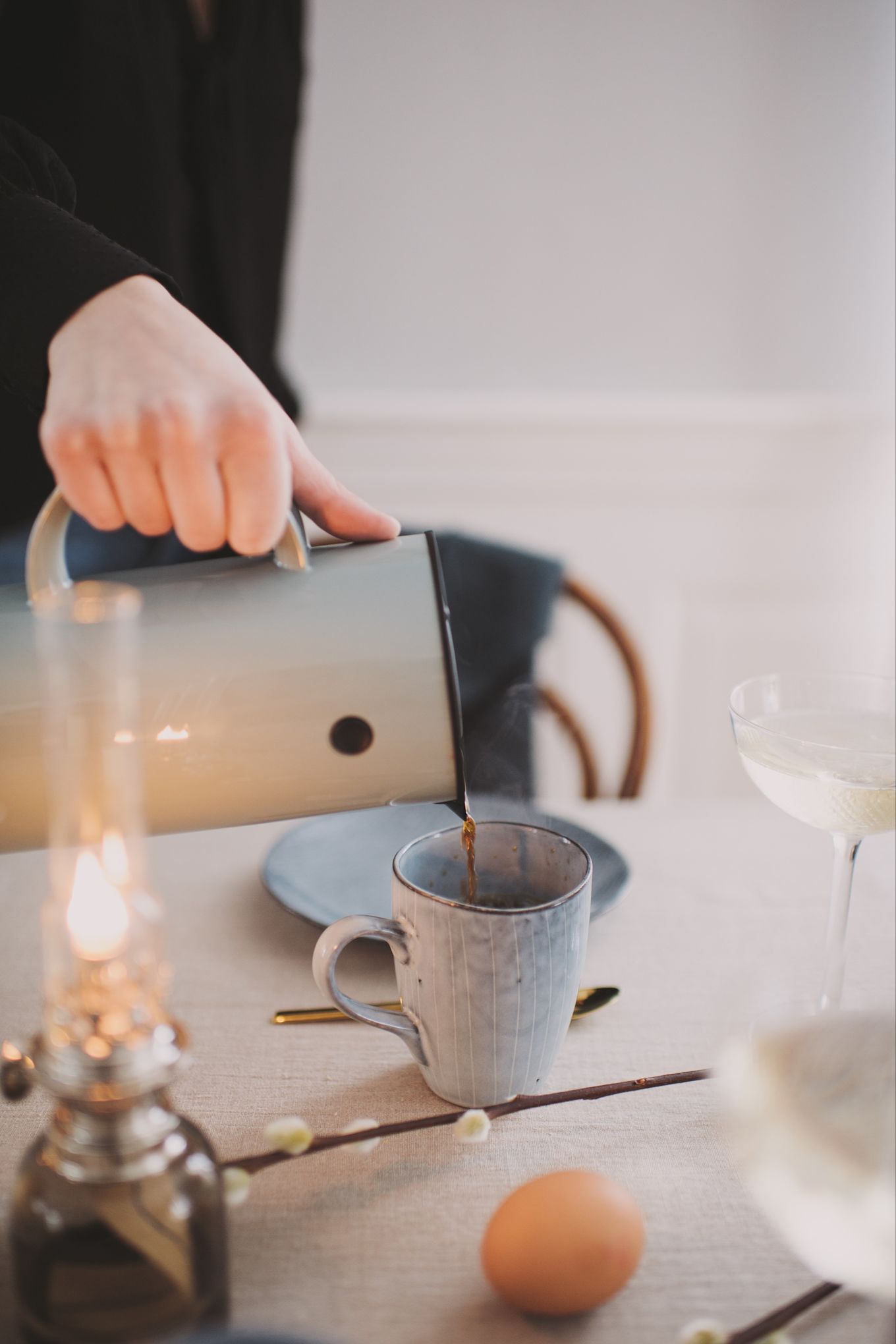 Coffee is served in a rustic mug in this Easter table setting.