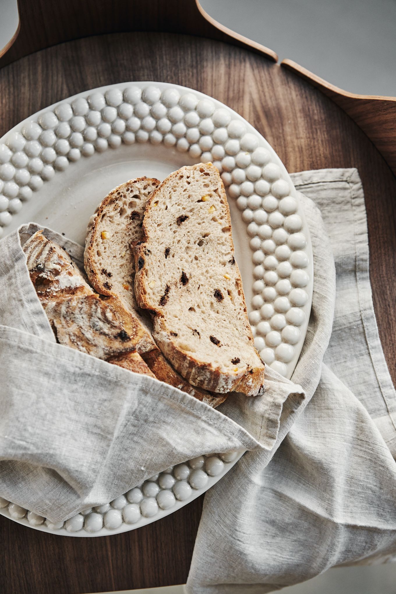 The Bubbles oval serving plate from Mateus in Sand with tasty crusty bread.