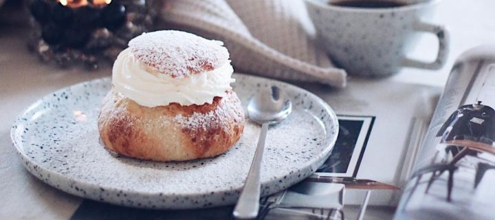 Popular Swedish pastries include semlor - yeast rolls filled with marzipan and cream, which you can see here on a Poppi plate from Olsson & Jensen in the home of Swedish influencer @picsbyellen.