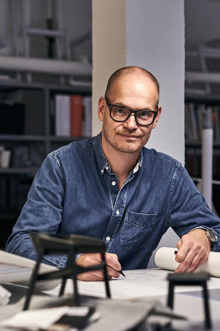 Danish designer Thomas Bentzen sketches in his studio.