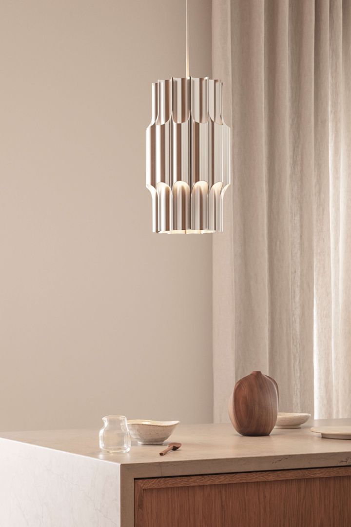 Decorate with metals in interior design 2025, here the stylish lamp Pan from Lyfa in aluminium. 