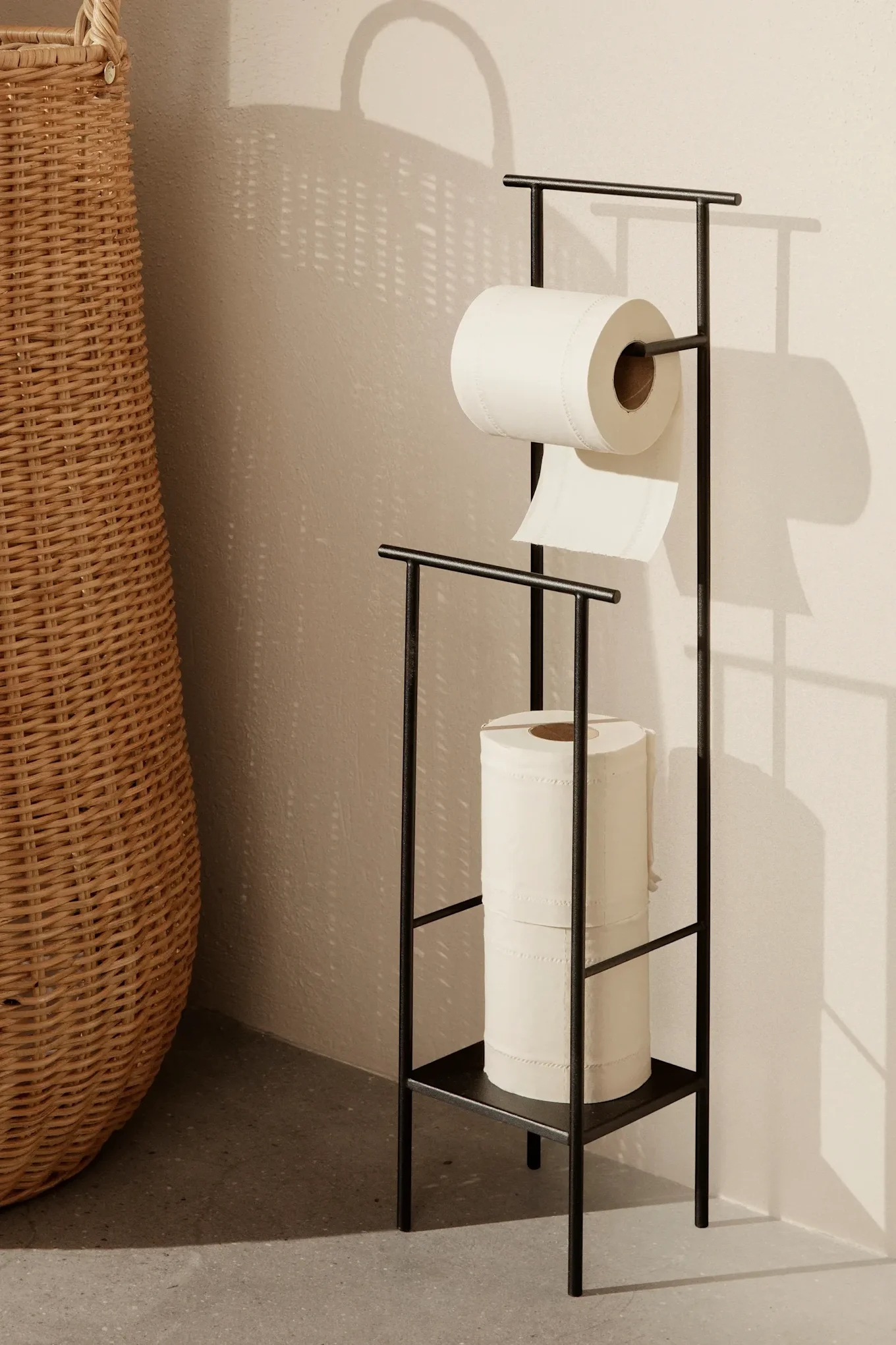 Storage ideas for small bathrooms - here you see the Dora toilet roll holder from ferm LIVING with storage for extra rolls. 