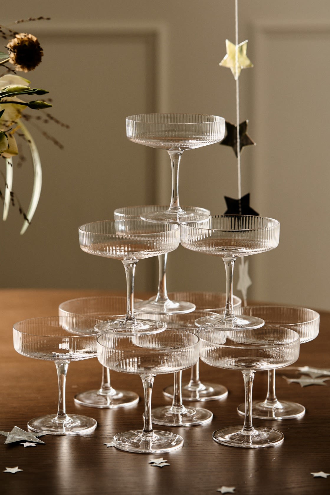 Discover how to build a champagne tower like the one you see here with three tiers and the Ripple coupe glasses from ferm Living. 