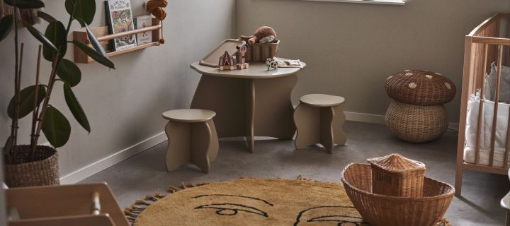 Tips and ideas for your childs room. Here you see the Slope table and stools in a neutral coloured children's room with wicker details. 